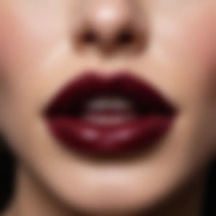 Close-up of lips adorned with a deep burgundy lipstick.