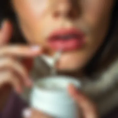 Applying Nourishing Cream A close-up of a person applying a nourishing cream, highlighting the importance of pampering the skin.