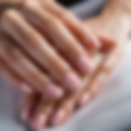 Close-up of beautifully manicured nails showcasing natural polish.