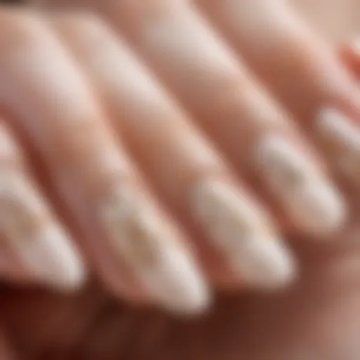 Elegant French almond nail design featuring intricate patterns