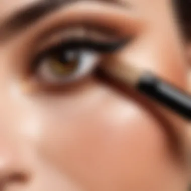 Close-up of a makeup brush applying earth-toned eyeshadow.