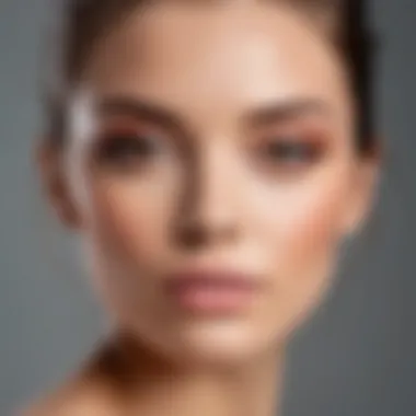 Close-up of a model showcasing a flawless makeup look with nude and blush tones.