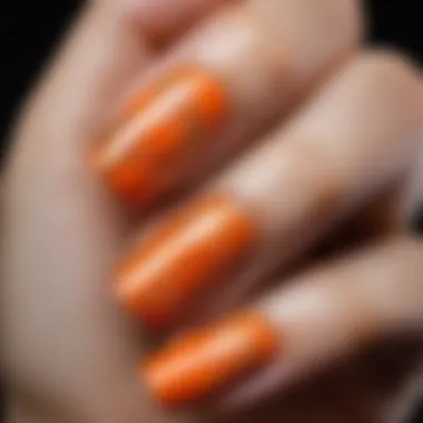 Elegant orange nail art design featuring intricate patterns