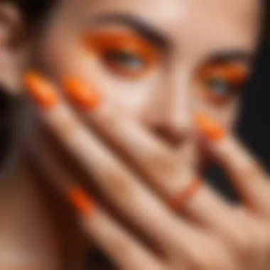 Vibrant orange nails styled for a summer party