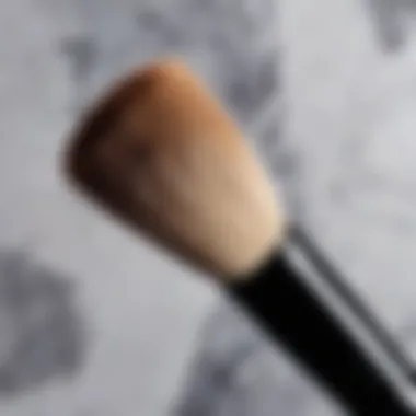 A pristine highlighter brush against a marble background