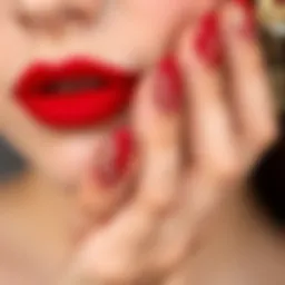 Elegant red nail art design featuring intricate patterns and embellishments