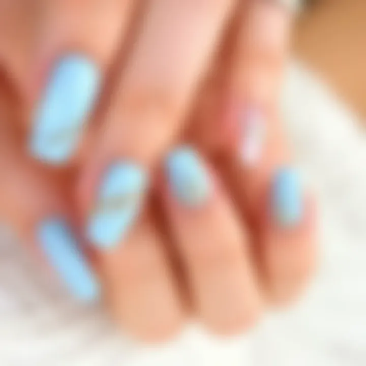 Stylish light blue nails with glitter accents