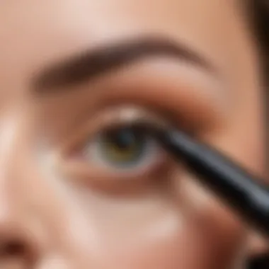 Makeup artist applying highlighter pencil to enhance eye features