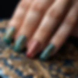 Close-up of beautifully manicured nails adorned with intricate designs