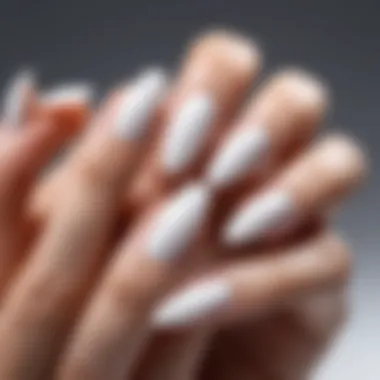 Different nail shapes with white polish technique applied