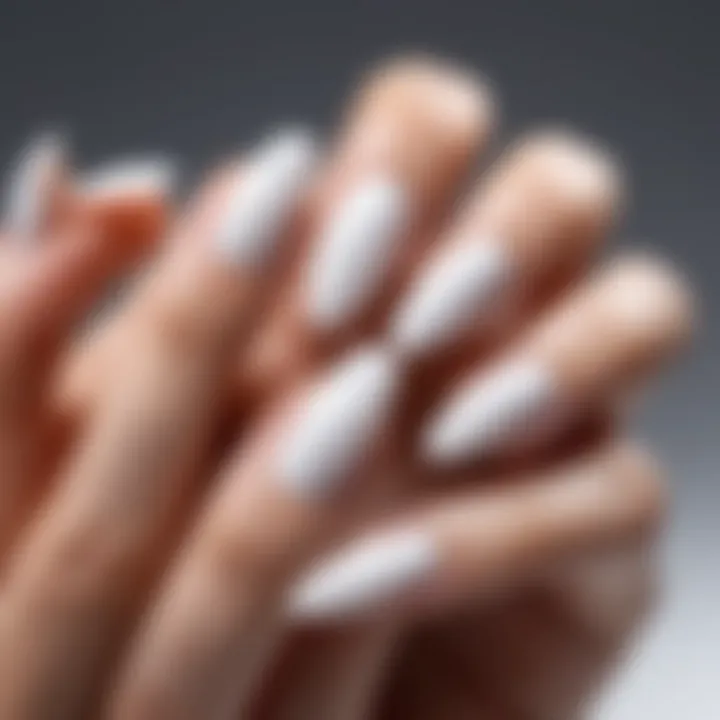 Different nail shapes with white polish technique applied