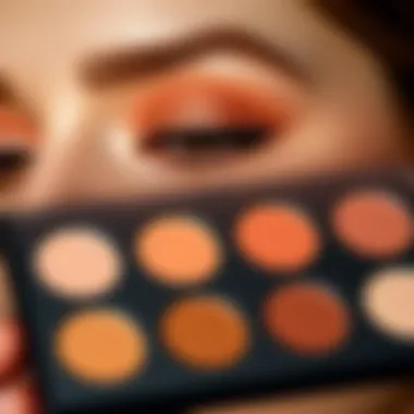 Palette of peach shades used for eye makeup application.