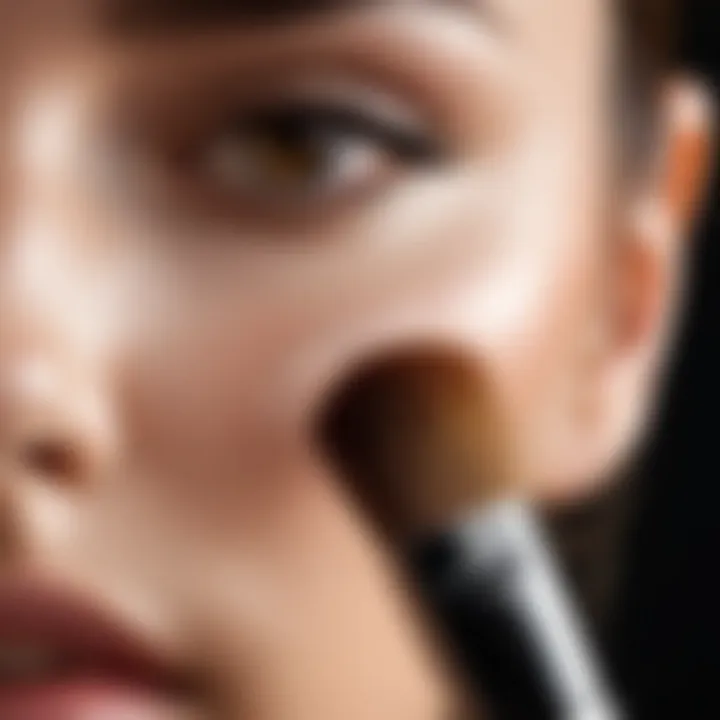 Close-up of a makeup brush applying foundation on skin with precision