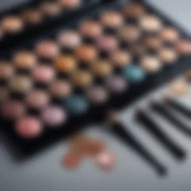 A close-up of shimmering eyeshadow palette and tools for makeup application.