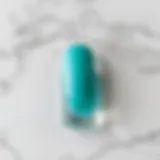 Turquoise nail polish swatch on a marble background