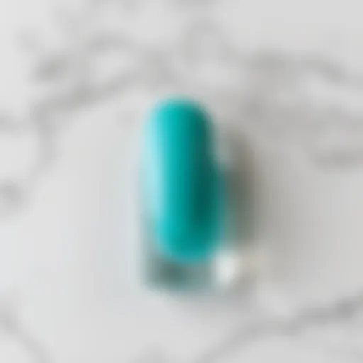 Turquoise nail polish swatch on a marble background