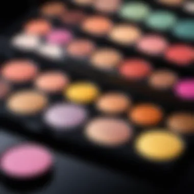 Sponge and Eyeshadow Palette Sponge applicator next to a palette of vibrant eyeshadows